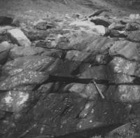 Photograph showing deformation of rocks in two stages: first the folding in the western part of the photograph and second the faulting in eastern part of the photograph